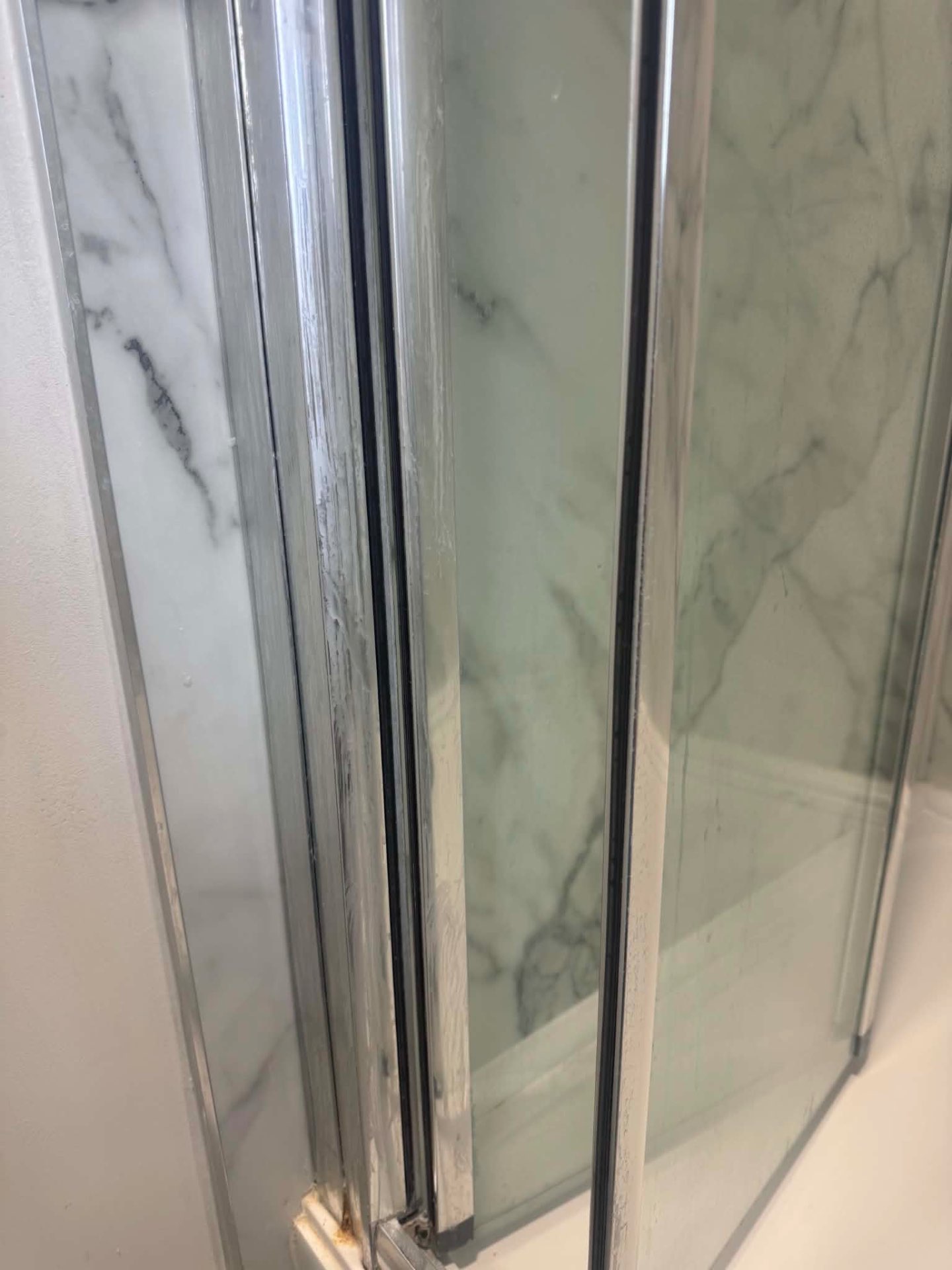 Office washroom in Watford before commercial deep clean — limescale on chrome and stone